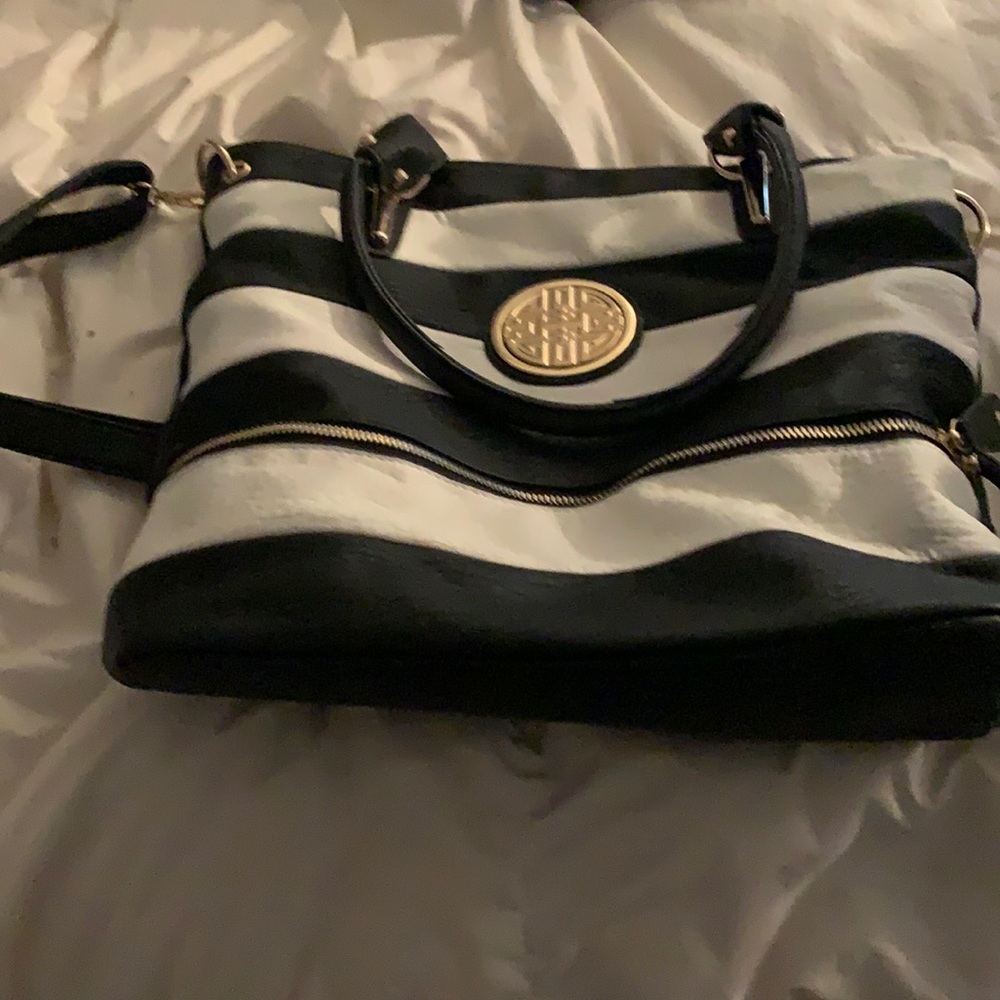 Black, white, and gold striped shoulder bag